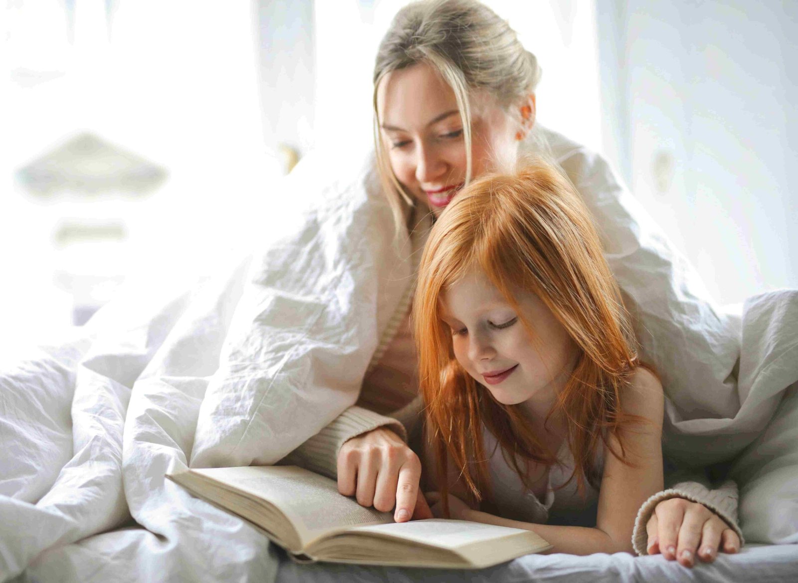 Mother and child reading together